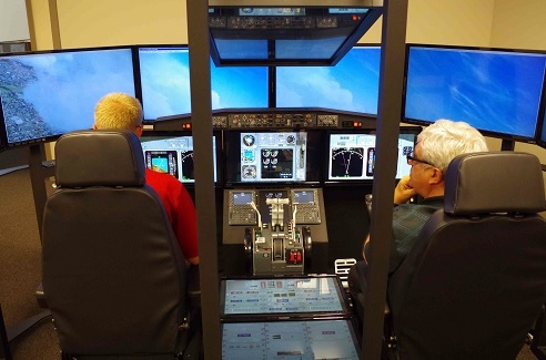 Photo courtesy of the Human-Centered Design Institute, Florida Institute of Technology, using OpusFSX networked multi-screen synchronised displays with Prepar3D